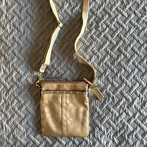 Elegant Coach gold crossbody bag